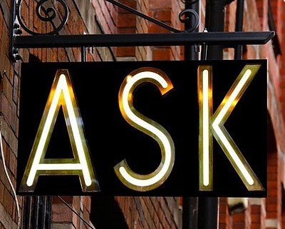 A neon sign saying ASK